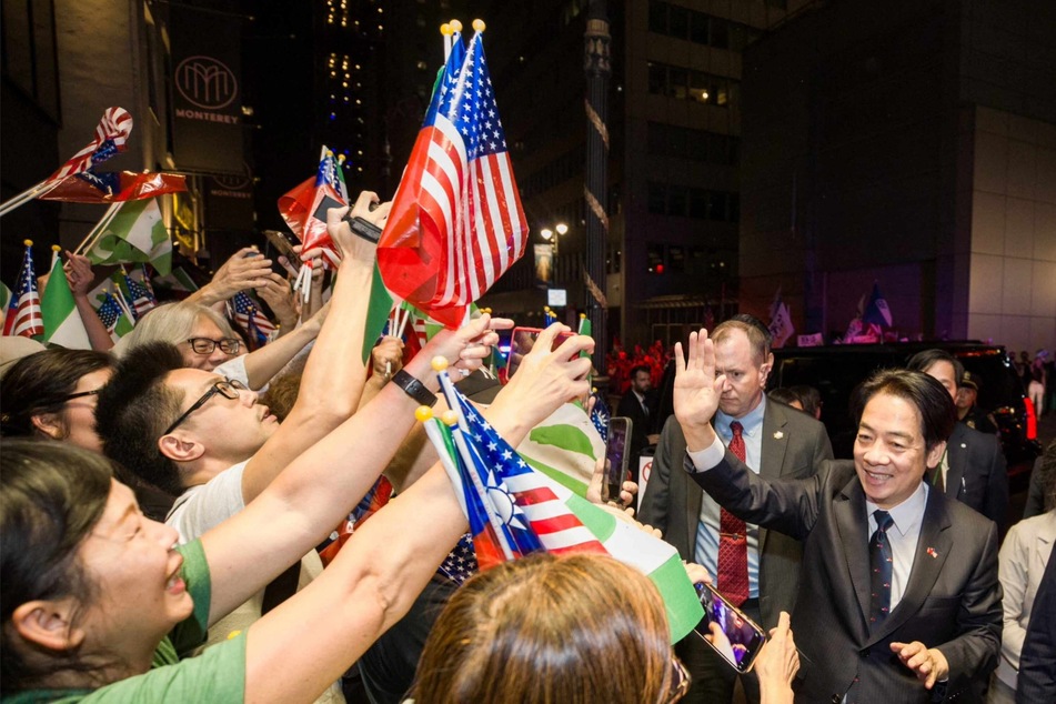 Taiwan's Vice President William Lai greeted supporters in New York who waived green-and-white flags, commonly used by those endorsing Tawain's independence.