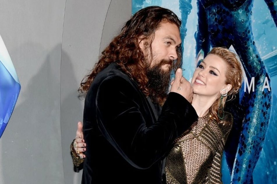 While a Hollywood expert testified that Momoa (l.) fought to keep Heard (r.) in the Aquaman sequel, a DC exec claimed that Heard was about to be replaced due to lack of chemistry between the two.