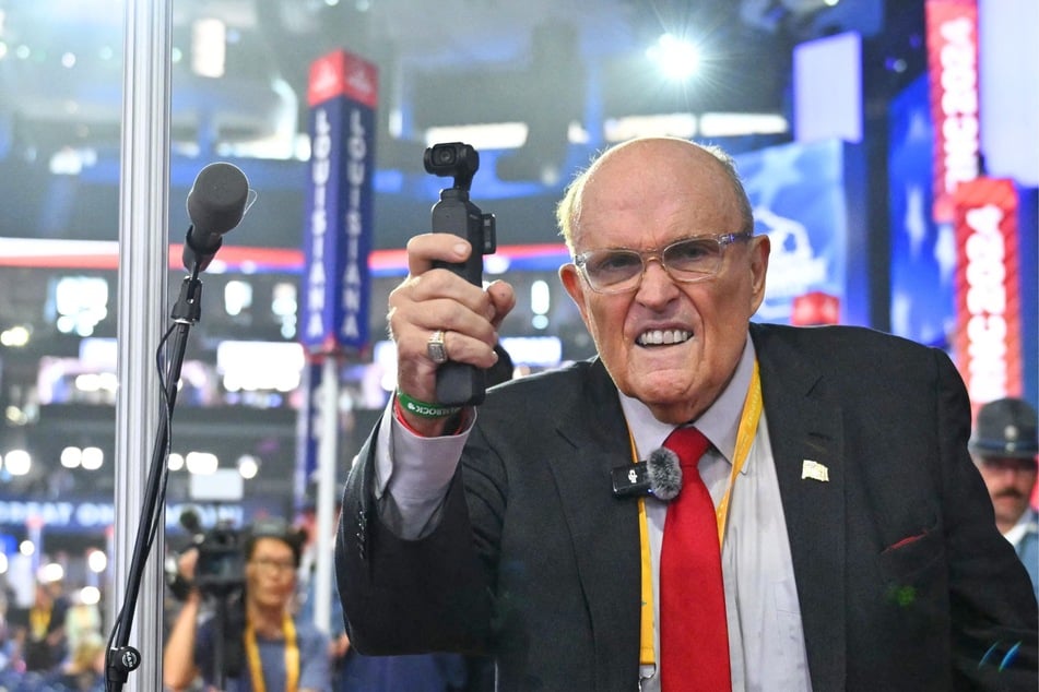 Rudy Giuliani using a handheld video camera during the second day of the 2024 Republican National Convention in Milwaukee, Wisconsin, July 16, 2024.