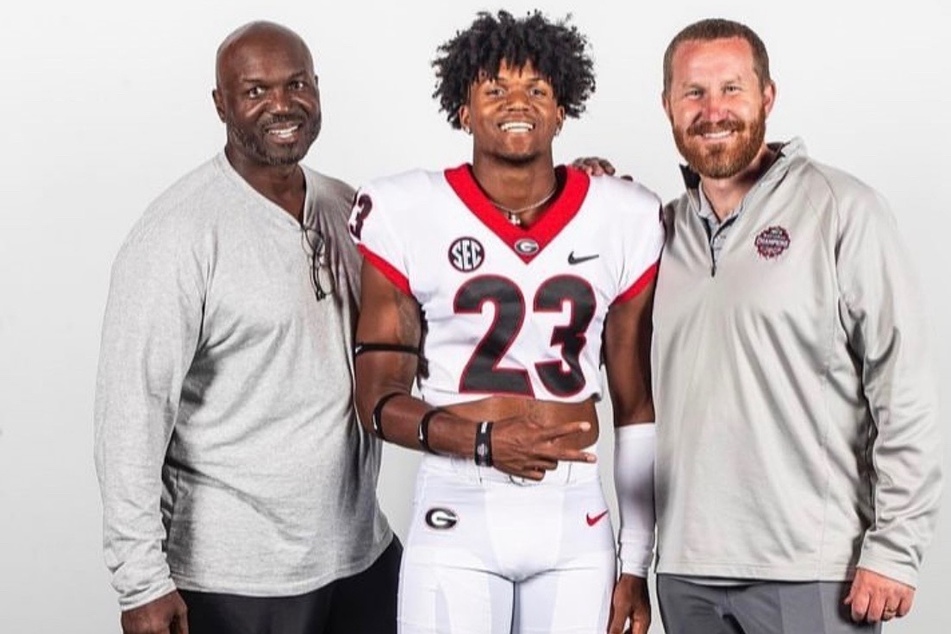 Todd Bowles (l.), Troy Bowles (c.), and Georgia's Co-defensive Coordinator Glenn Schumann (r.) pose for a photo after Troy announces his commitment.