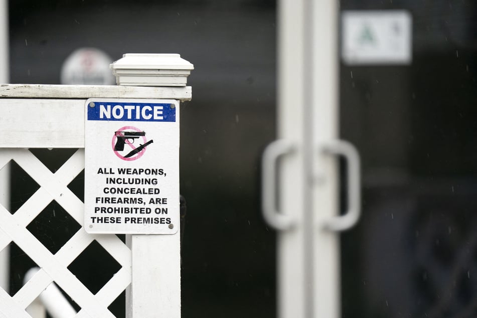 A sign prohibiting firearms is pictured outside Willie's Bar &amp; Grill on St. Helena Island, South Carolina.