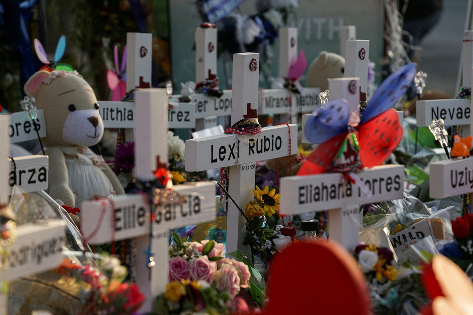 Flowers, toys, and other objects are laid to remember the victims of the Uvalde school shooting.
