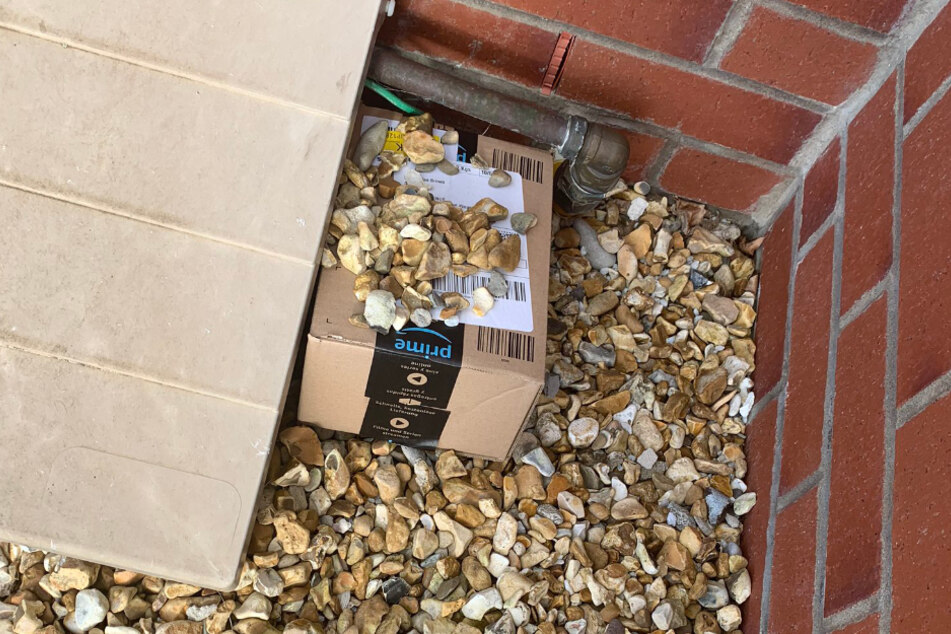 Hidden in plain sight: the package was camouflaged with a handful of pebbles.