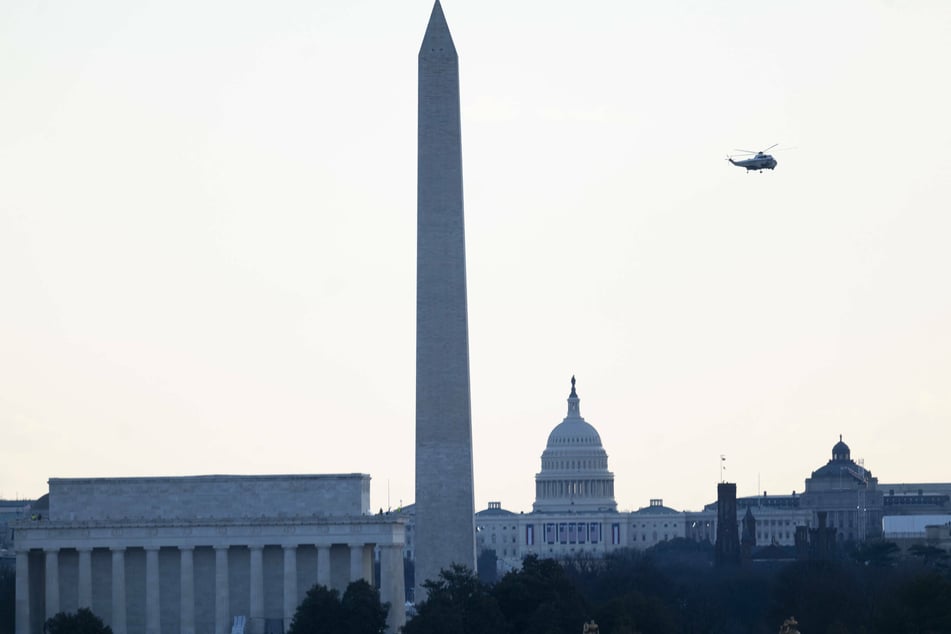 President Donald Trump does a final pass by the US Capitol after leaving the White House for the last time as president.