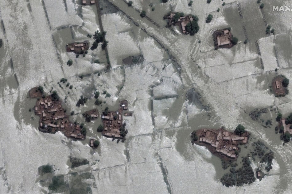 Satellite imagery shows Pakistani villages surrounded by surging waters.