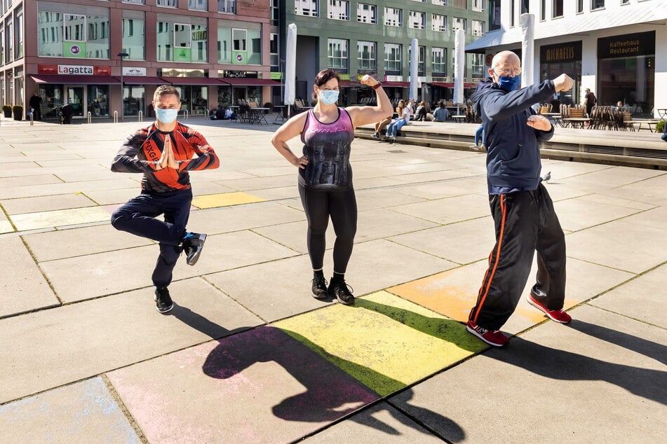 Nick Kedzierski (30, v.l.), Sandra Wolf (30) und Lutz Vogel (60) rufen am Samstag zur sportlichen Demo am Düsseldorfer Platz auf.