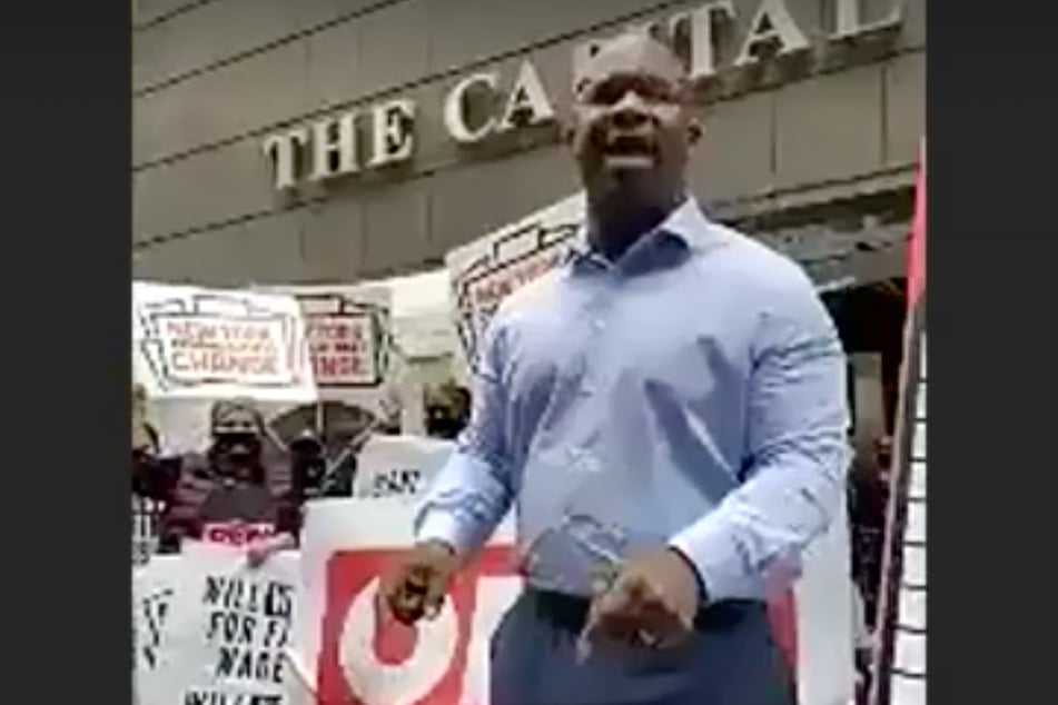 New York Rep. Jamaal Bowman led a crowd in chants calling for an increase to the minimum wage for essential workers.