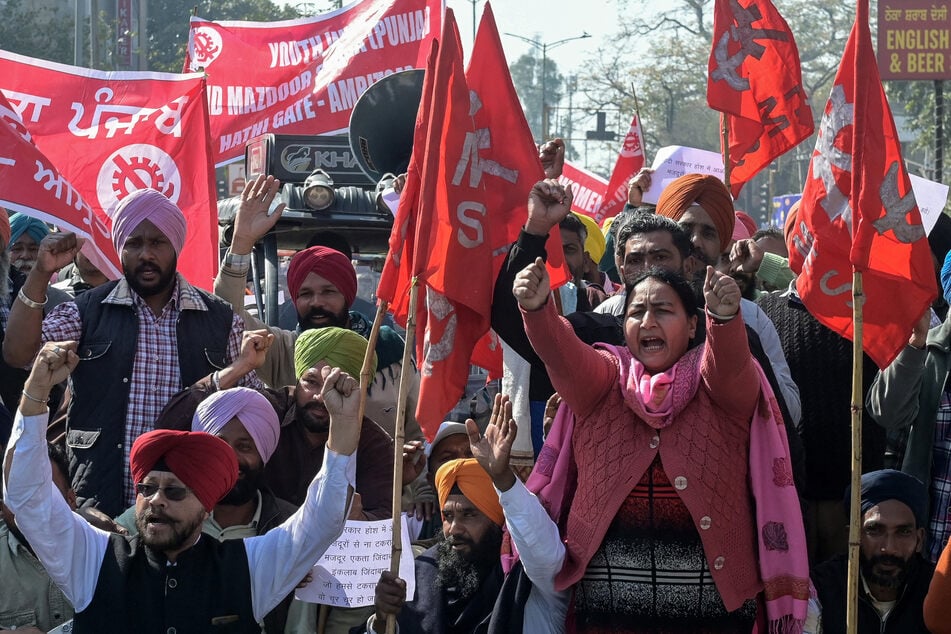 Farmers and trade union workers shout slogans during a nationwide strike in Amritsar, India, on February 12, 2026.