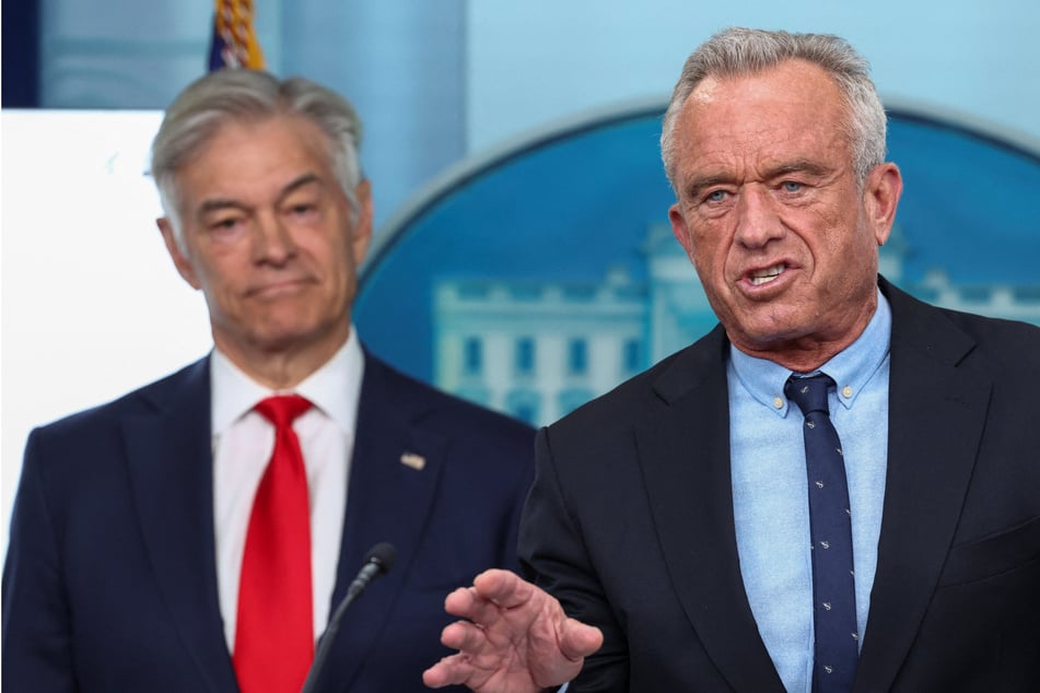 Health chief Robert F. Kennedy Jr. (r.) unveiled new guidelines on Wednesday that flip the traditional food pyramid to emphasize protein and healthy fats.