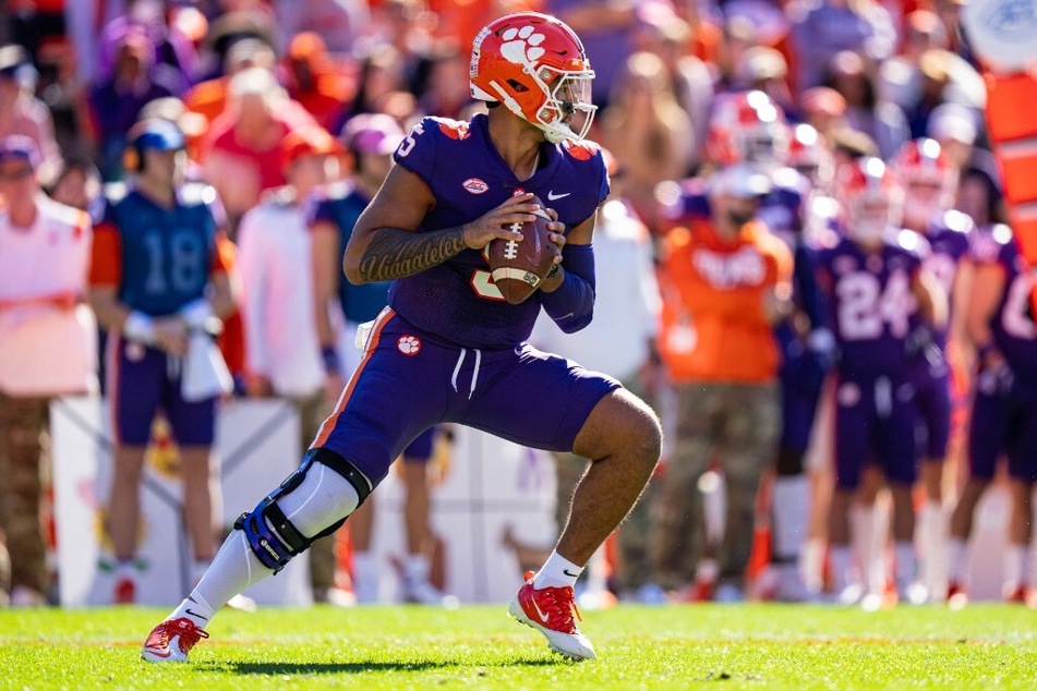 Quarterback D.J. Uiagalelei of the Clemson Tigers drops back to pass against the Connecticut Huskies during a game at Clemson Memorial Stadium.