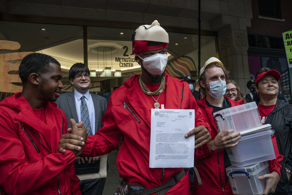 Former Amazon employee Chris Smalls holds a letter from NLRB acknowledging receipt of a petition to organize a union at the company's warehouse in Staten Island.