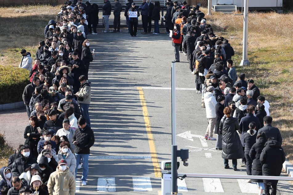 Hundreds of people lined up to pay their respects at a memorial altar set up to honor the victims.