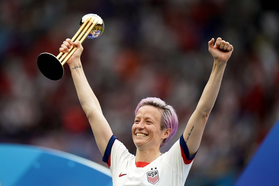 Meghan Rapinoe celebrates with the 2019 FIFA Women's World Cup trophy.