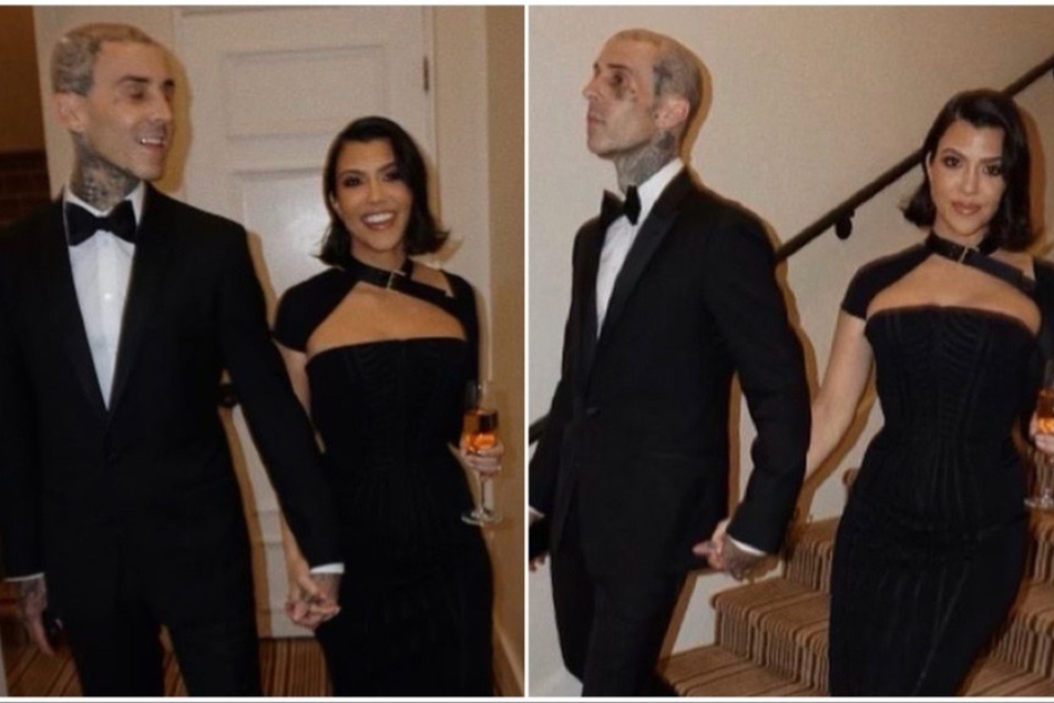 Kourtney Kardashian and Travis Barker pose while attending Simon Huck's wedding the Bel-Air hotel.