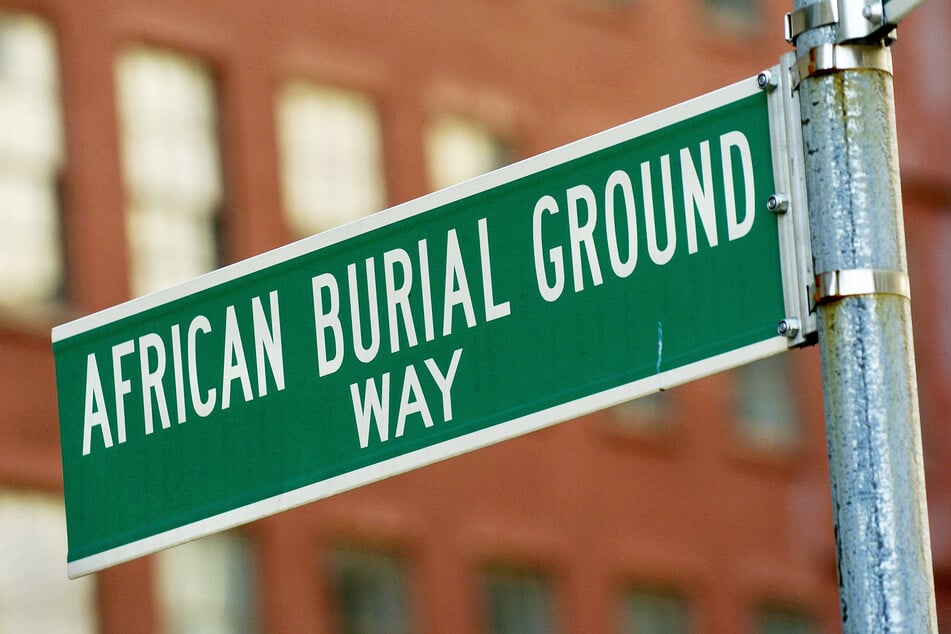 A sign designates the honorary name of the street that runs past the African Burial Ground National Monument in New York City.