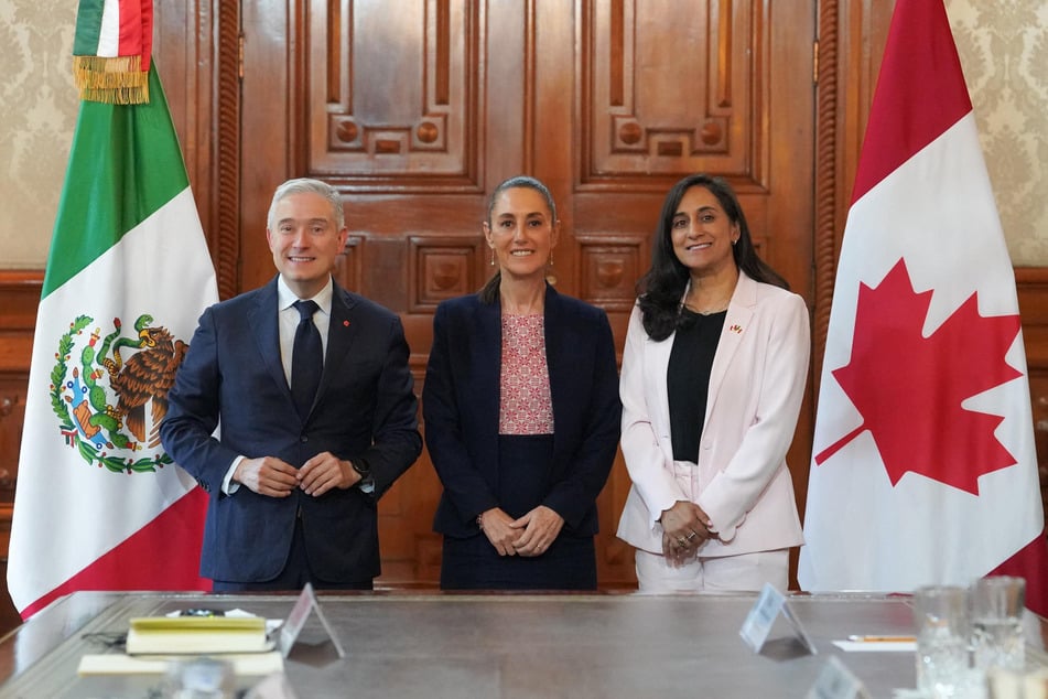 From l. to r.: Canada's Finance Minister Francois-Phillippe Champagne, Mexico's President Claudia Sheinbaum, and Canada's Foreign Minister Anita Anand pose for a picture after a meeting at the National Palace in Mexico City on August 5, 2025.