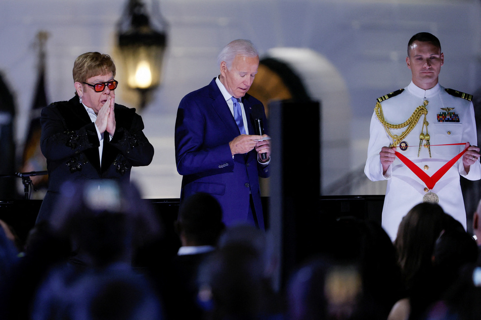 Elton John (l.) was surprised with the National Humanities Medal by President Joe Biden.