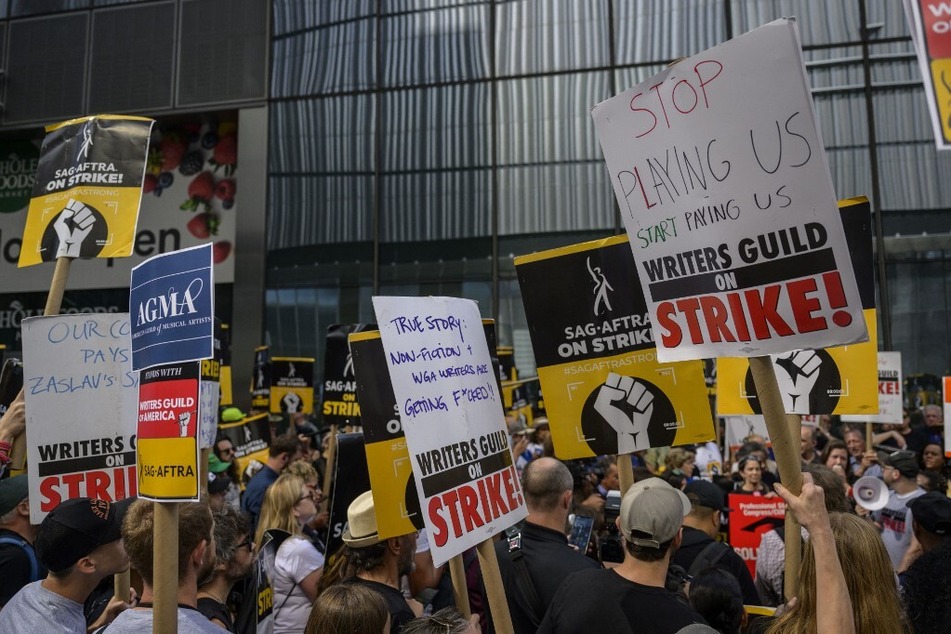 Actors, writers and other union members join SAG-AFTRA and WGA strikers on a picket line in front of the offices of HBO and Amazon, during the National Union Solidarity Day in New York City.
