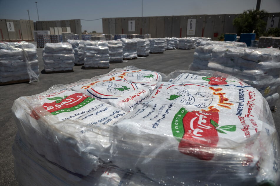 Humanitarian aid for the Gaza Strip waits to be loaded into trucks at the Kerem Shalom border crossing between southern Israel and Gaza, on June 17, 2024.