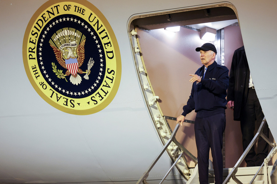 President Joe Biden gestures as he deboards Air Force One in Dover, Delaware.