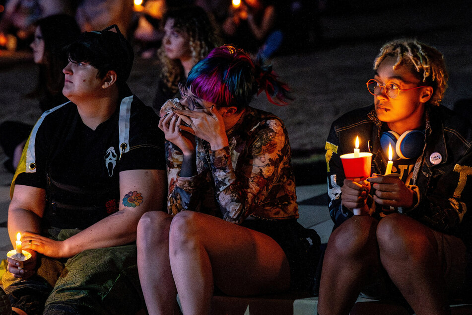 People attend a vigil in memory of Nex Benedict, who died a day after an altercation in a girls' high school bathroom in Owasso, Oklahoma.