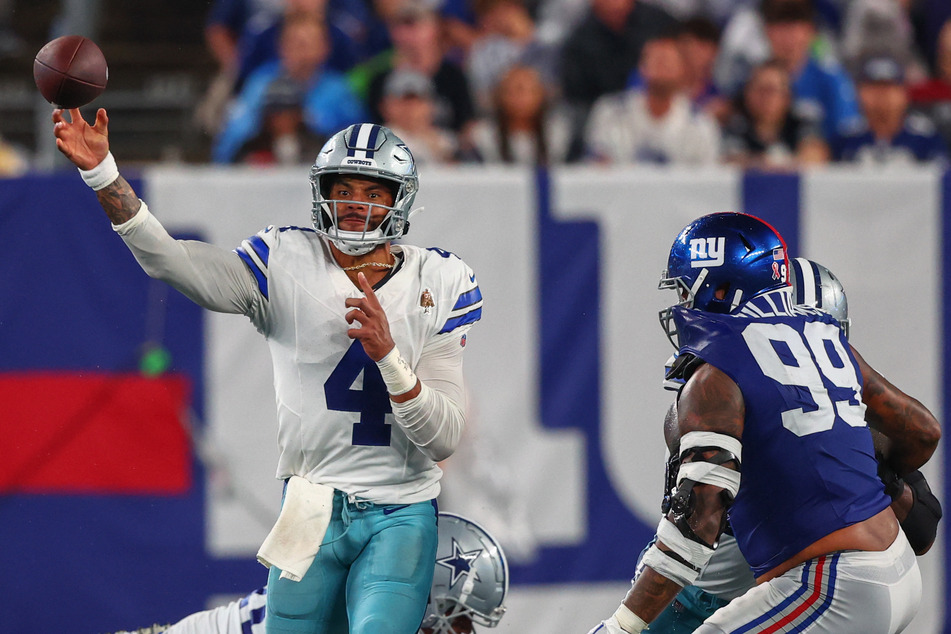 Dallas Cowboys quarterback Dak Prescott throws a pass against the New York Giants during the second half at MetLife Stadium.