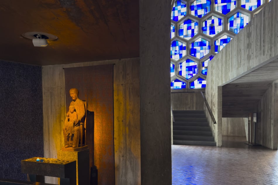 A statue of the Virgin Mary holding the Christ Child is illuminated inside Saint John's Abbey in Collegeville, Minnesota.