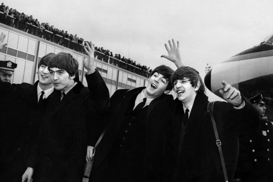 From l. to r.: The Beatles members John Lennon, Ringo Starr, Paul McCartney, and George Harrison arrive at John F. Kennedy Airport in New York on February 7, 1964.