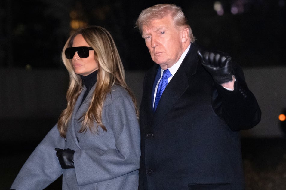 President Donald Trump (r) and First Lady Melania Trump (l) walking across the South Lawn of the White House after arriving on Marine One on Monday.