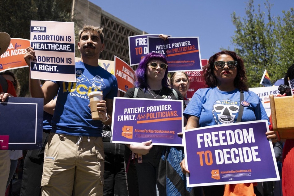 Reproductive rights advocates protest an 1864 abortion ban outside the Arizona State Capitol in Phoenix.