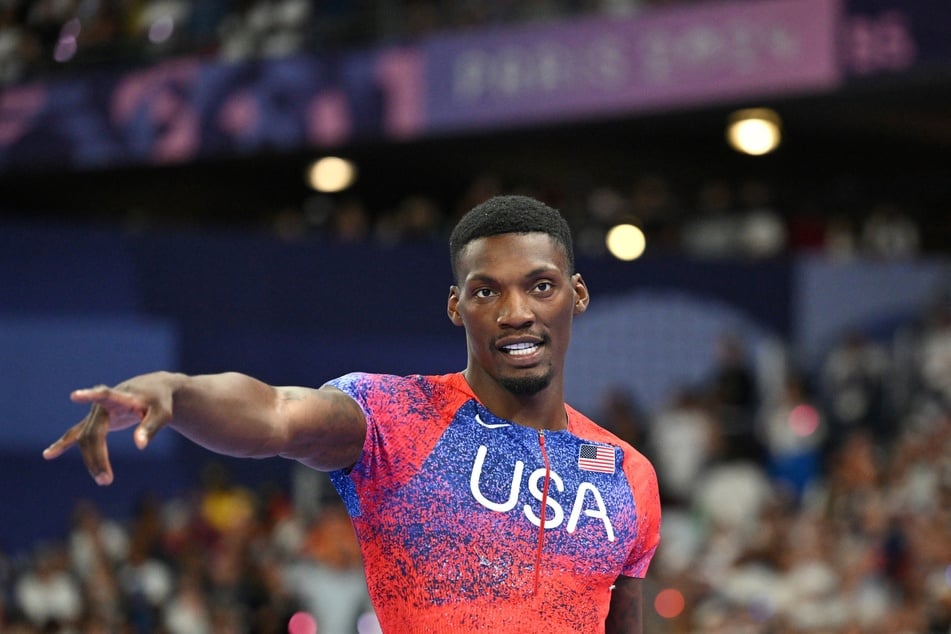 US' Fred Kerley celebrates after winning bronze in the men's 100m final of the athletics event at the Paris 2024 Olympic Games at Stade de France in Saint-Denis, north of Paris, on August 4, 2024.
