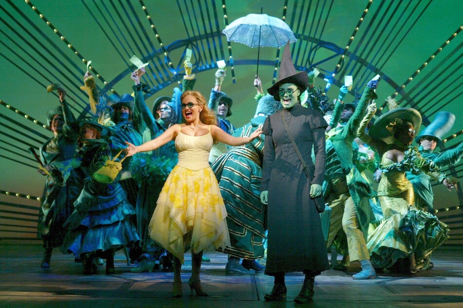 The story of Wicked features witches Glinda (front l.) and Elphaba (front r.), who will be played in the movie by Ariana Granda and Cythia Erivo, respectively.