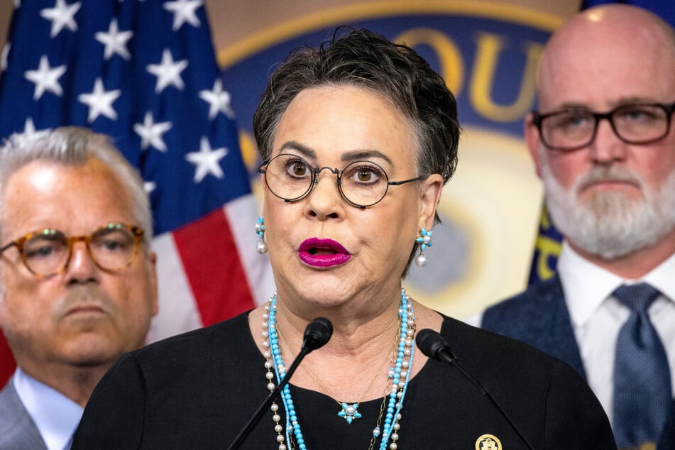 Congresswoman Harriet Hageman (c.) stormed out of a town hall on Tuesday after the crowd pressed her about Trump's immigration agenda.