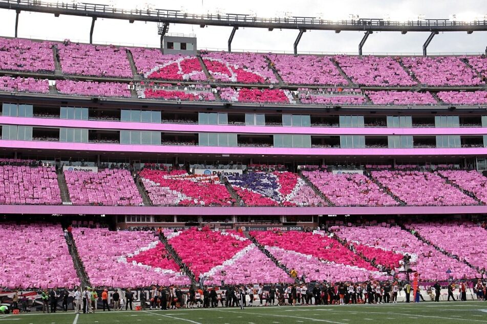 New England Patriots fans participate in a card stunt during a Crucial Catch game against the Cincinnati Bengals in in honor of Breast Cancer Awareness Month.