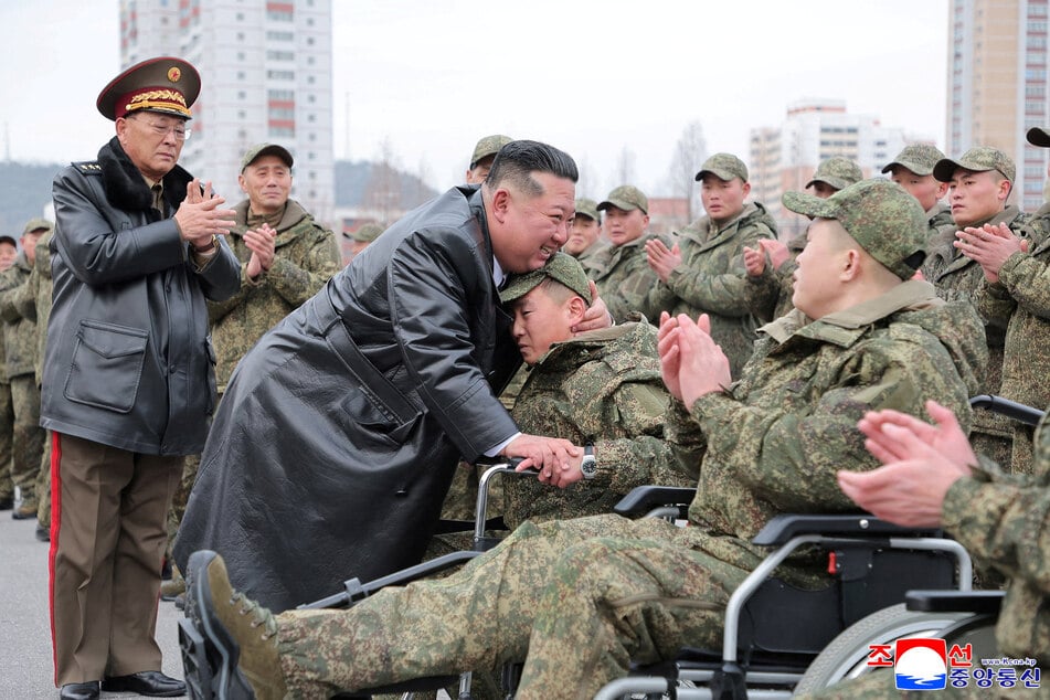 North Korean leader Kim Jong-un (c.) publicly acknowledged he had sent troops to clear mines in Russia as part of its war with Ukraine.