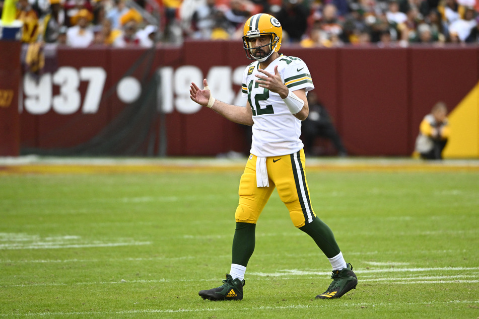 Green Bay Packers quarterback Aaron Rodgers reacts against the Washington Commanders during the second half at FedExField.