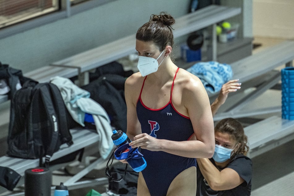 Lia Thomas walks to the pool to swim for the for the University of Pennsylvania at an Ivy League meet against Harvard University in Cambridge, Massachusetts, on January 22, 2022.