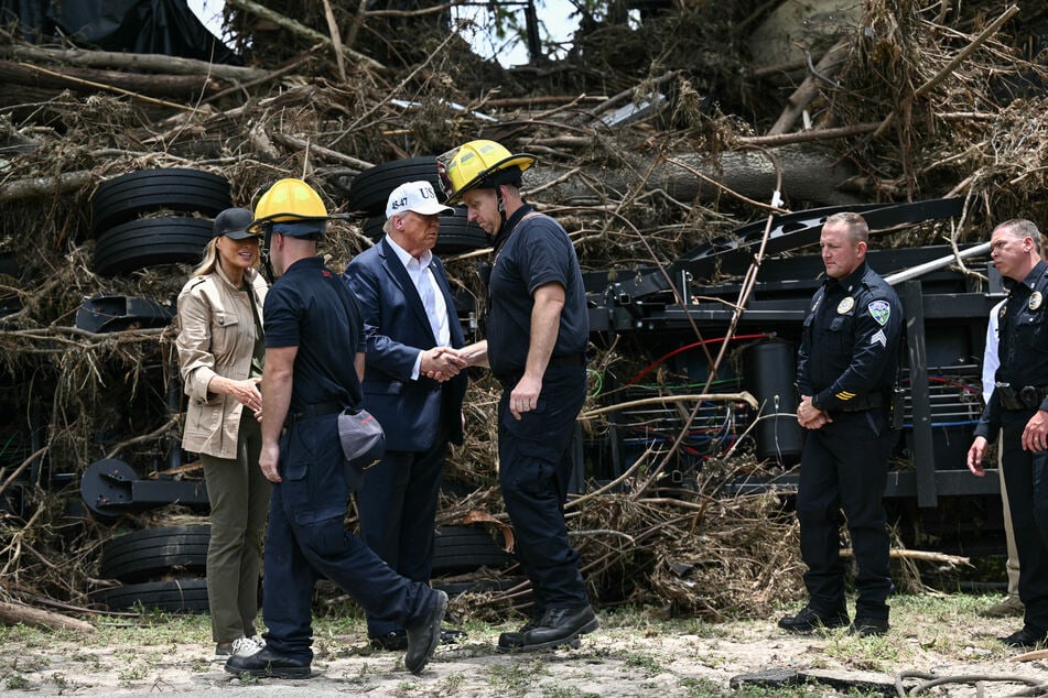President Donald Trump and First Lady Melania Trump greet first responders near the Guadalupe River following devastating flooding that occurredm in the area over the July 4 weekend, in Kerrville, Texas, on Friday.