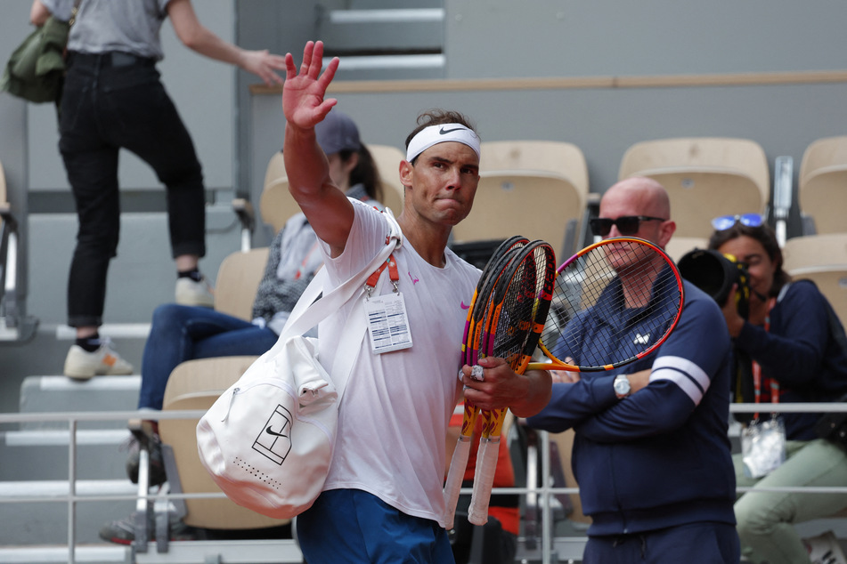 Rafael Nadal waves after a practice session ahead of the French Open.