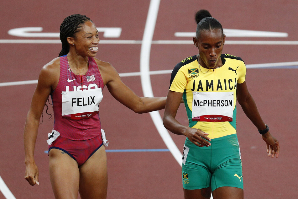 Stephenie Ann McPherson of Jamaica (r.) and Allyson Felix of the USA finished 1-2 respectively in the women's 400-meter semi-final on Wednesday.