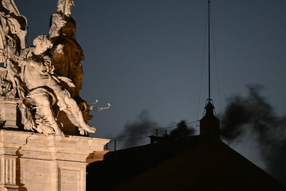 Thick black smoke emerged from the Sistine Chapel's chimney Wednesday in a sign that cardinals failed to elect a new pope in their first conclave vote.