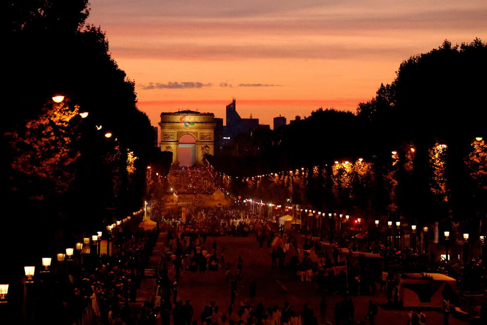 The Arc de Triomphe is lit during the Paris Paralympics opening ceremony.