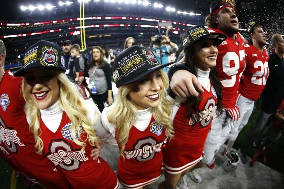 Ohio State cheerleaders and players celebrating the the 82nd Goodyear Cotton Bowl Classic win.