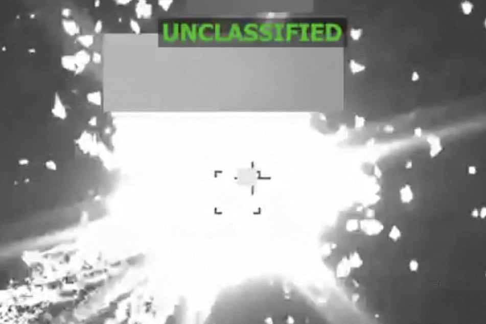 This screen grab from a video posted by US Defense Secretary Pete Hegseth on his X account on November 6, 2025, shows a lethal kinetic strike on a vessel in the Caribbean.