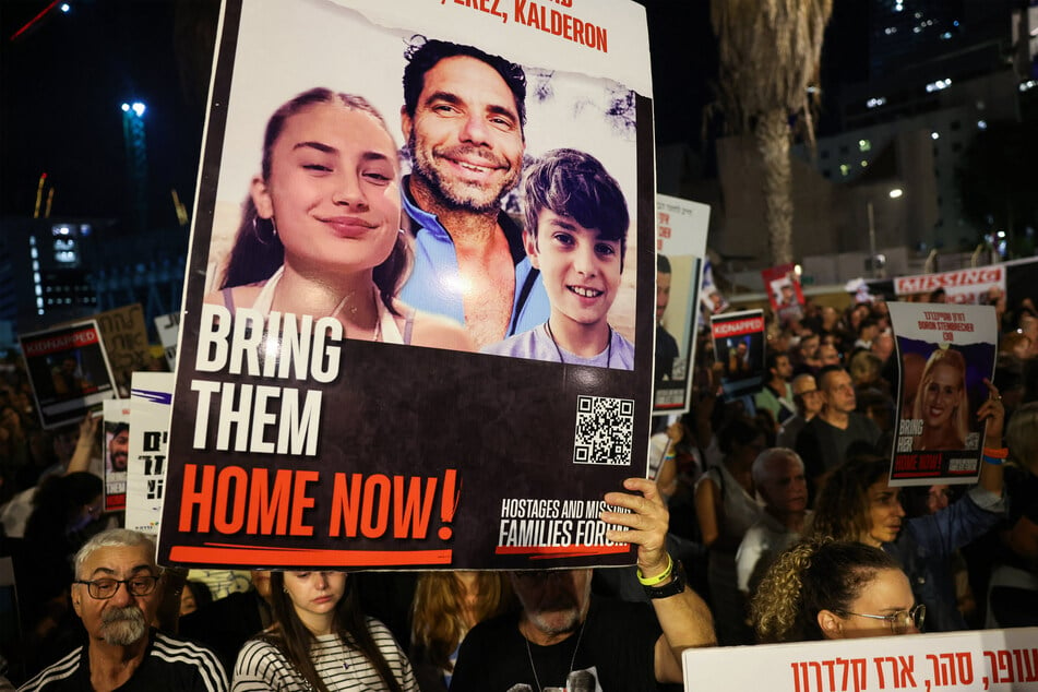 Protesters lifted placards as they rallied in Israel on Saturday to demand the release of Israelis held hostage in Gaza since the October 7 attack by Hamas militants.