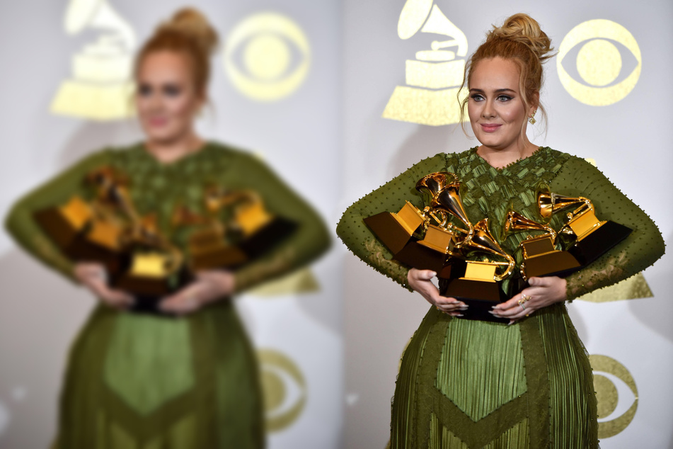 Adele backstage with her awards for Album Of The Year, Best Pop Vocal Album for 25, Song Of The Year, Record Of The Year ,and Best Pop Solo Performance for Hello during the 59th annual Grammy Awards in 2017. (Archive image).