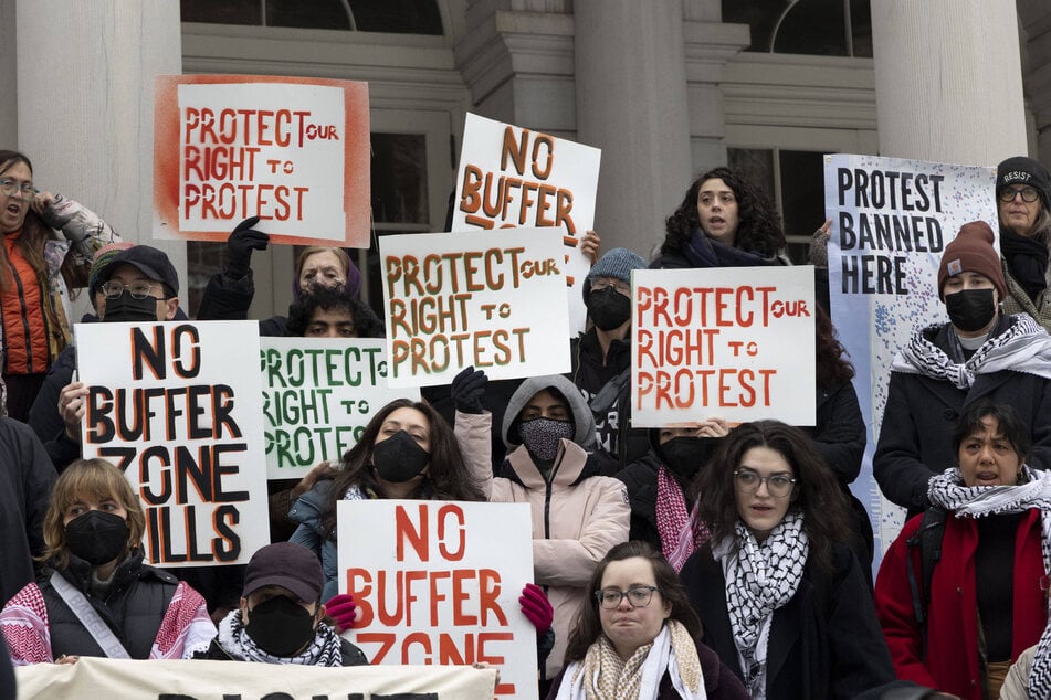 A coalition of organizations rally on the steps of New York City Hall in opposition to bills that would ban protests in buffer zones near places of religious worship and buildings affiliated with educational facilities.