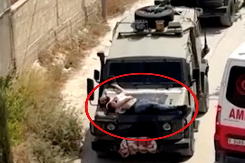 Israeli soldiers tied a wounded Palestinian to the hood of a military vehicle during a raid on Jenin in the illegally occupied West Bank.