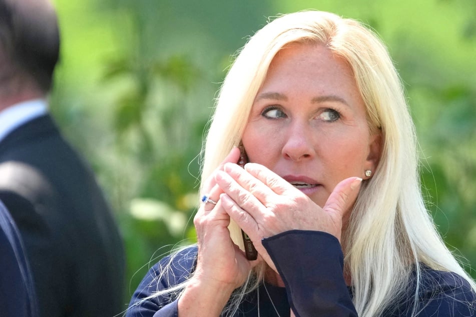 Marjorie Taylor Greene threatens to call cops on reporter: "You're harassing me!"