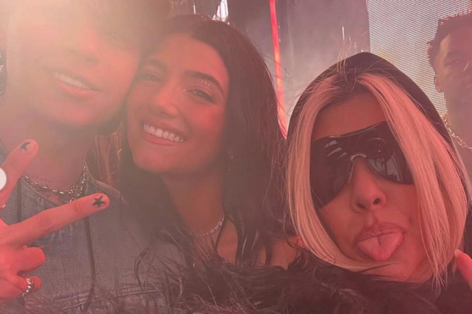 Kourtney Kardashian (r) got dissed by Travis Barker's ex-wife Shanna Moakler, who accused Kourt of posting her and Travis' kids more than her own.